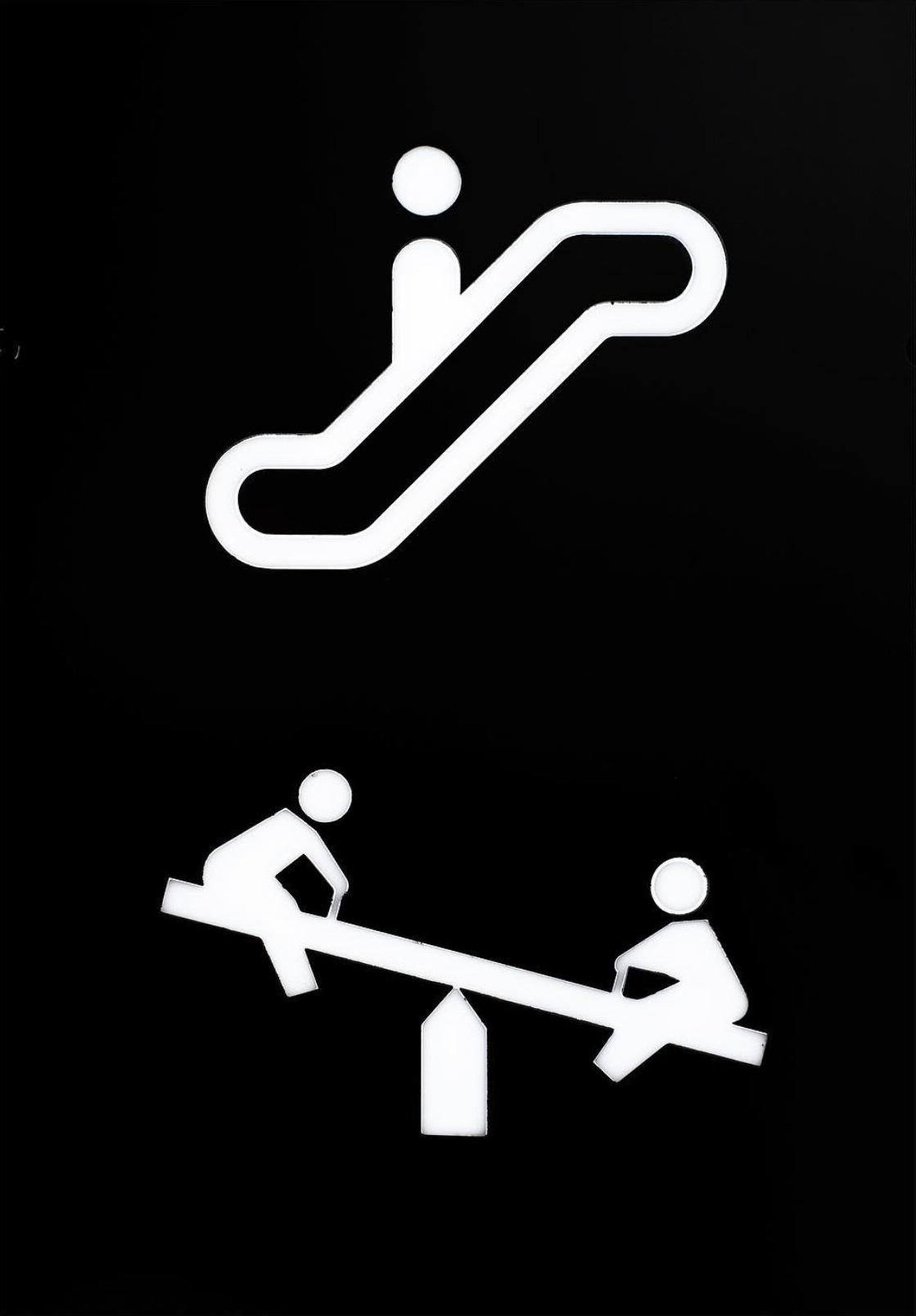 White escalator and seesaw symbols against a black background